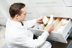Pharmacist check his schedule